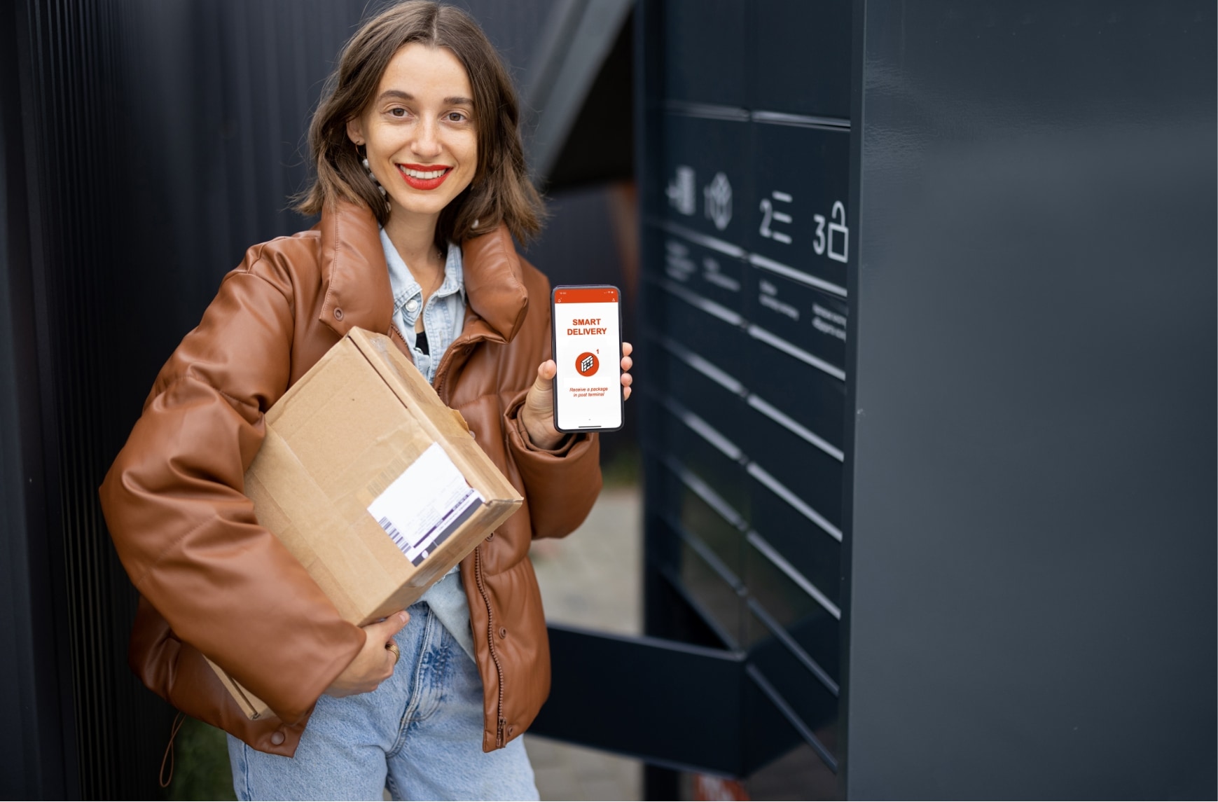 A woman pickups a parcel in a secure locker.