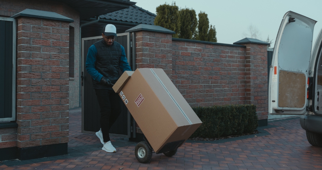 delivery driver carrying large parcels